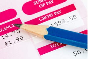 Image of a pencil and a wage slip